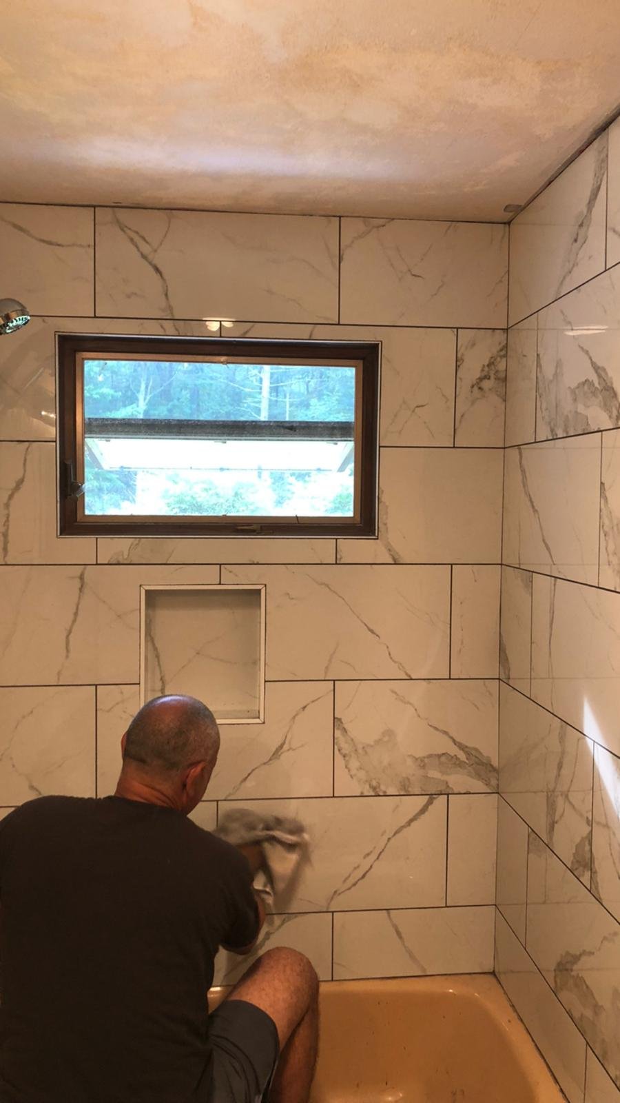 Remodeled tile surface by Souza Installation